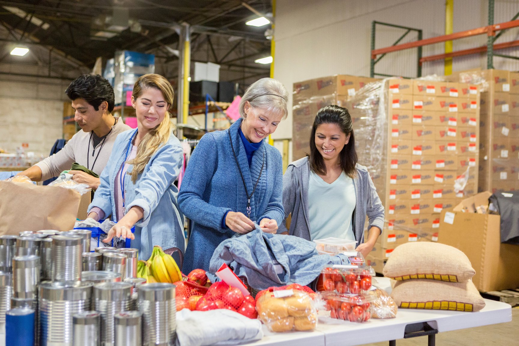 Food bank volunteers sort donations